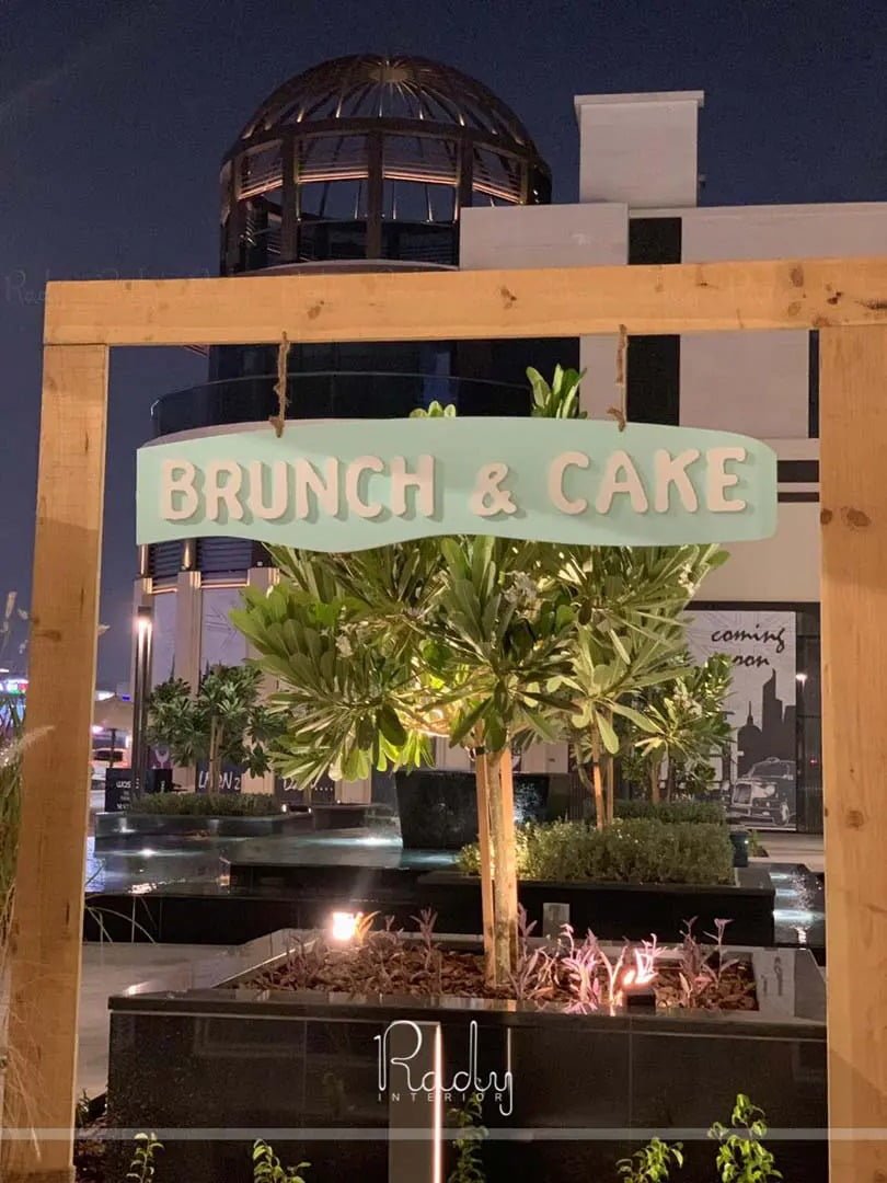Cozy restaurant interior at Brunch and Cake featuring soft colors, curated decor, and elegant furniture.