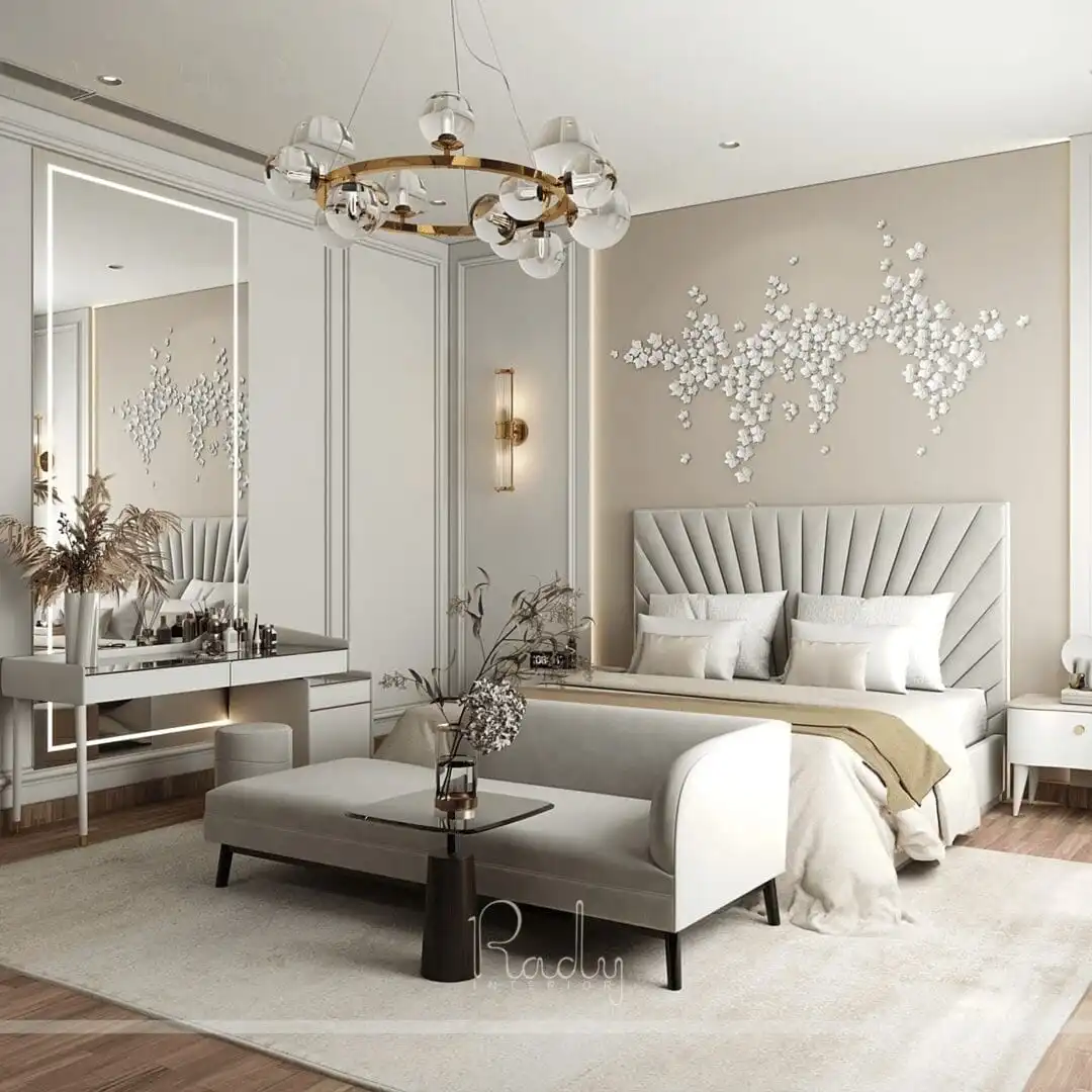 Modern bedroom featuring a large bed and an expansive mirror, designed by Rady Interior.