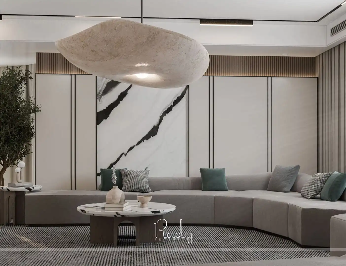 Modern living room featuring a large marble table and stylish chairs, designed by Rady Interior.