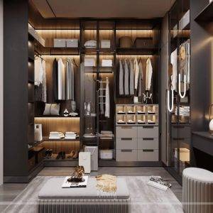 Luxury walk-in wardrobe interior design in Dubai featuring bespoke joinery, glass wardrobes, integrated lighting, and premium finishes by Rady Interior